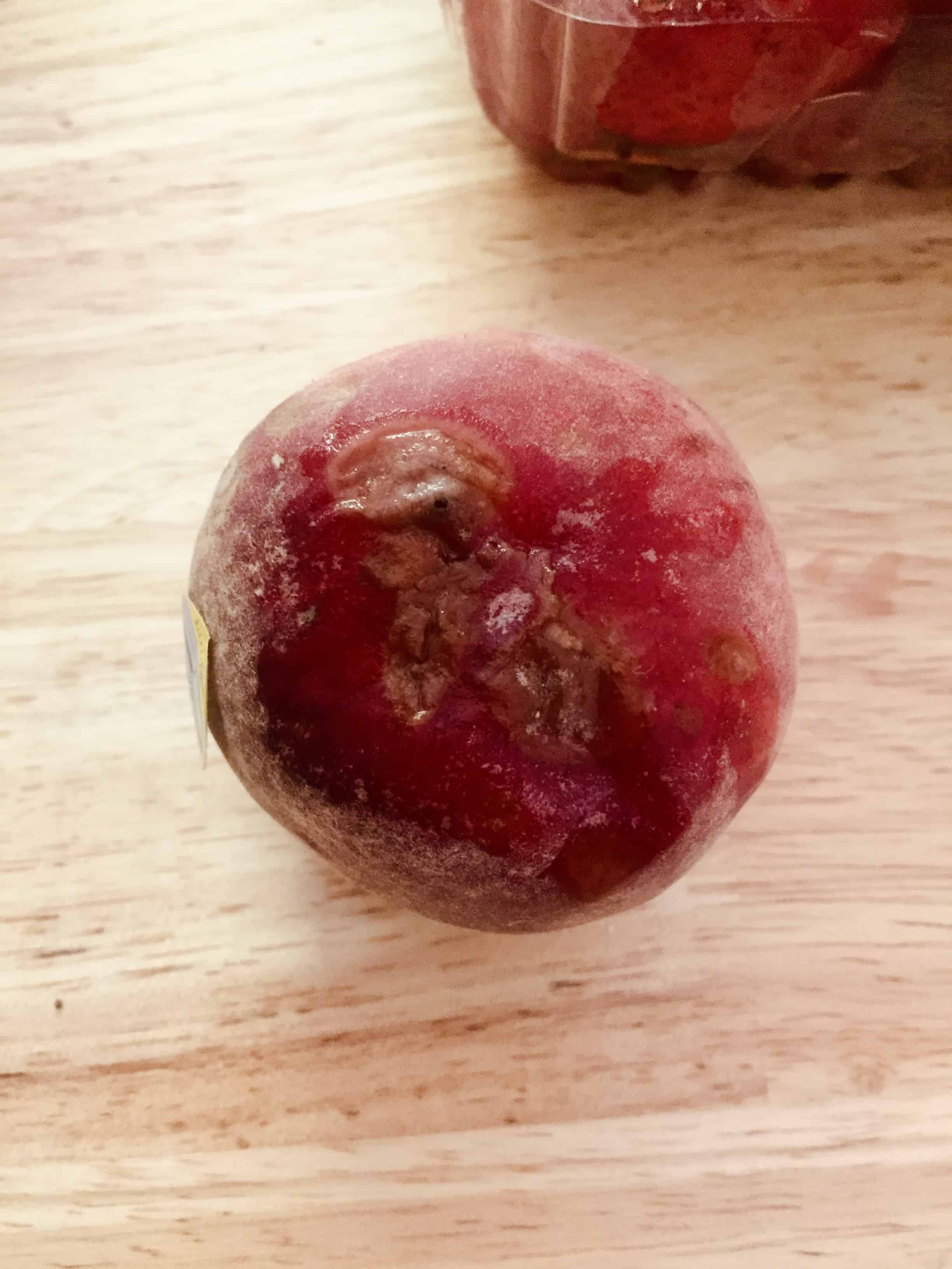 This peach wasn't imperfect. It was inedible. It had mold and bruising on every side.
