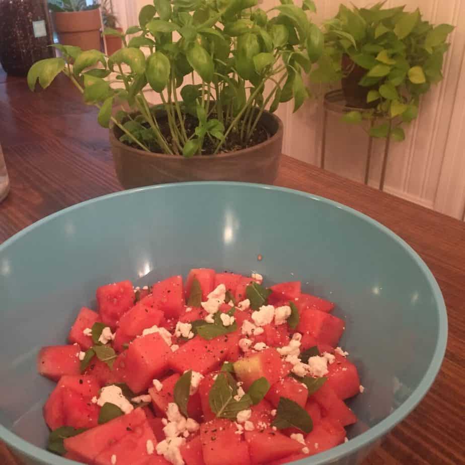 Watermelon salad replete with baisl, mint and feta