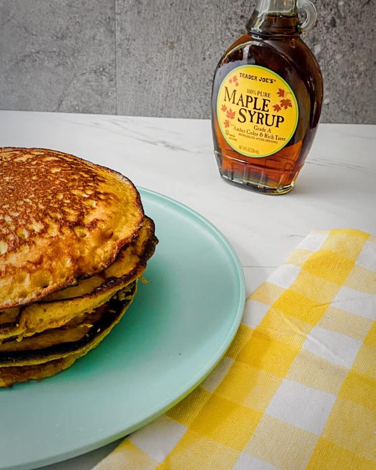 Trader Joe's maple syrup in the background behind my banana blender pancakes