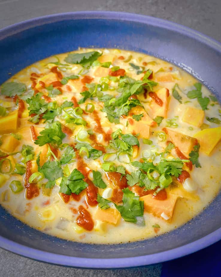 Up close shot of my bright, delicious, Thai Inspired Corn, Sweet Potato Coconut Tom Kha Soup