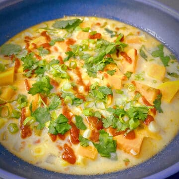 closeup shot of a bowl of vegetarian tom kha soup.