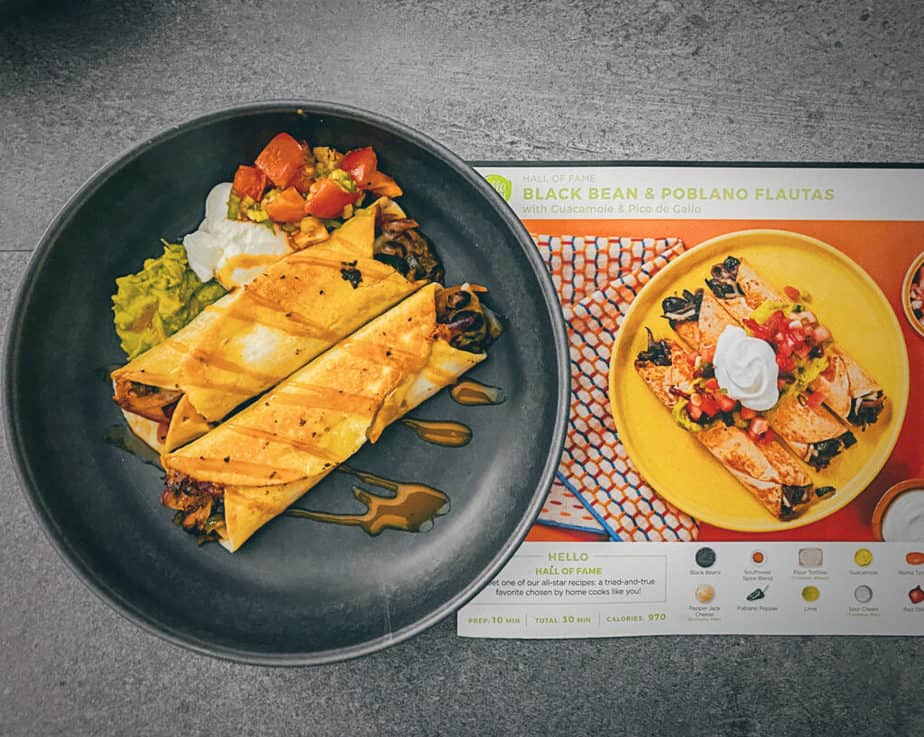 Overhead shot of black bean and poblano flautas next to HelloFresh's recipe sheet. I was able to make it look pretty close to the photo they sent, so if my review is purely based on that, HelloFresh does well!