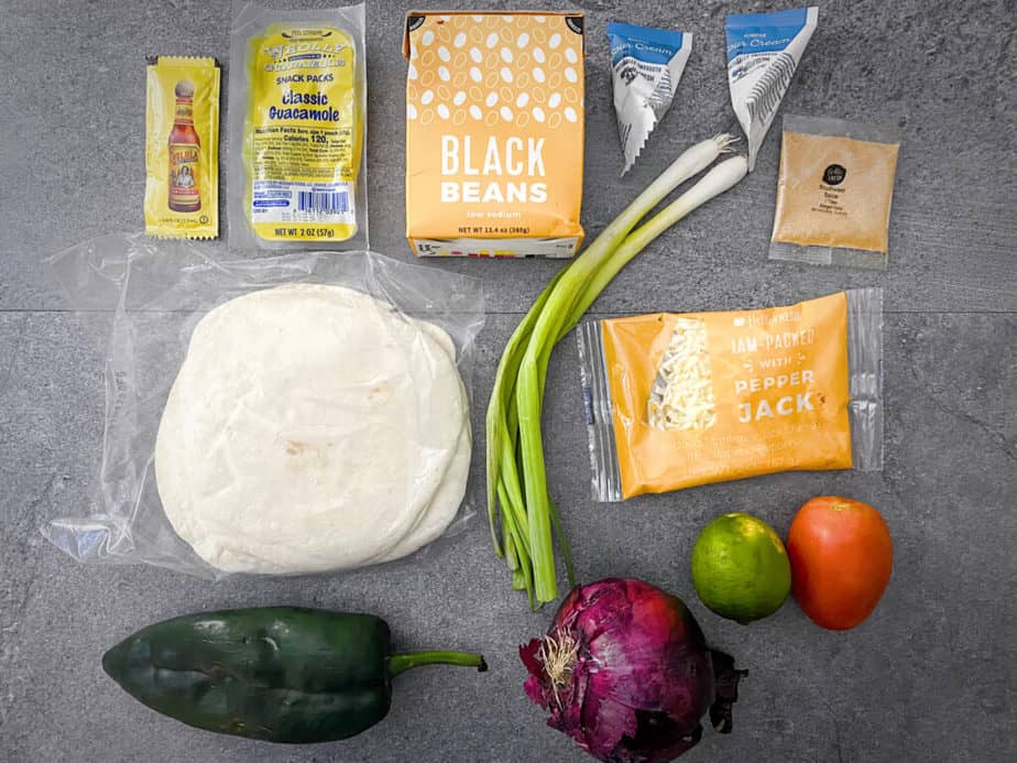 Ingredients for HelloFresh's Black Bean Flautas. I could only recycle the bags the tortillas, green onions and spice mix came in, and the tetrapack the beans came in.
