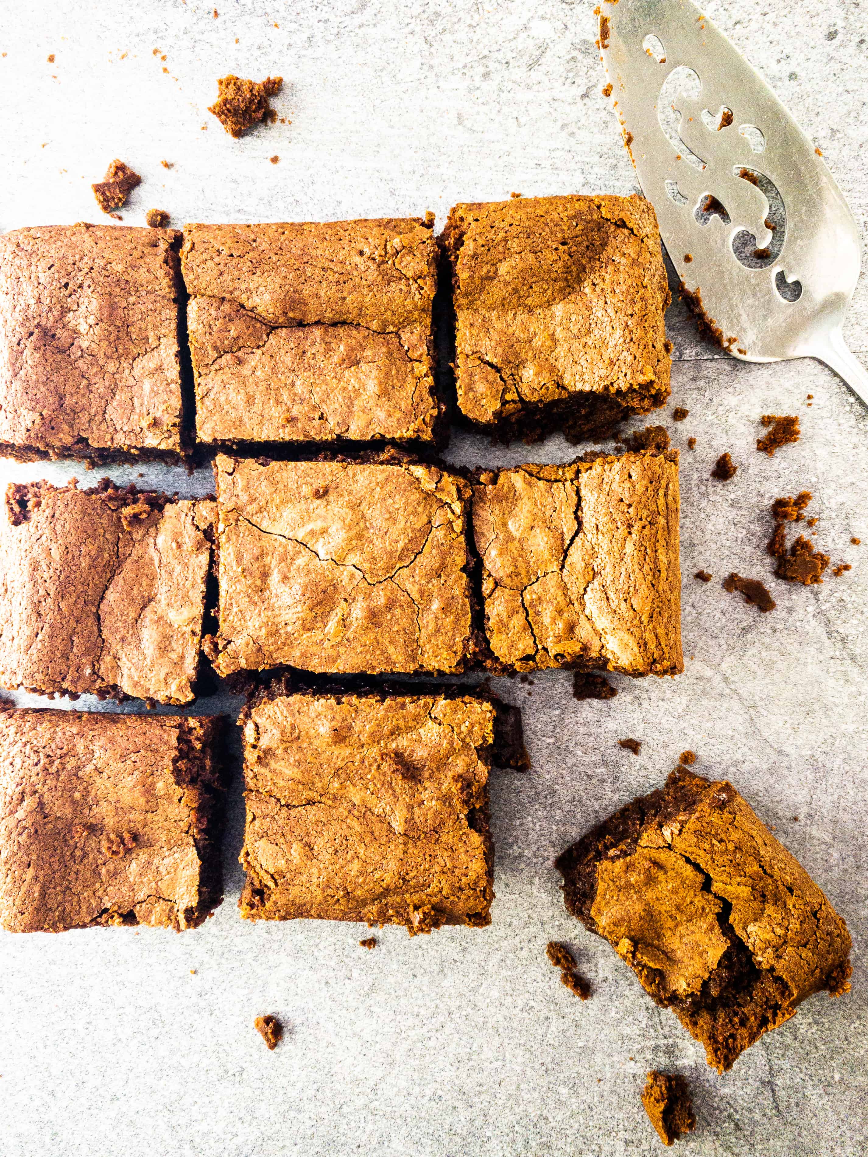 Overhead grid shot of Julia Child's brownies cut into 9 squares.