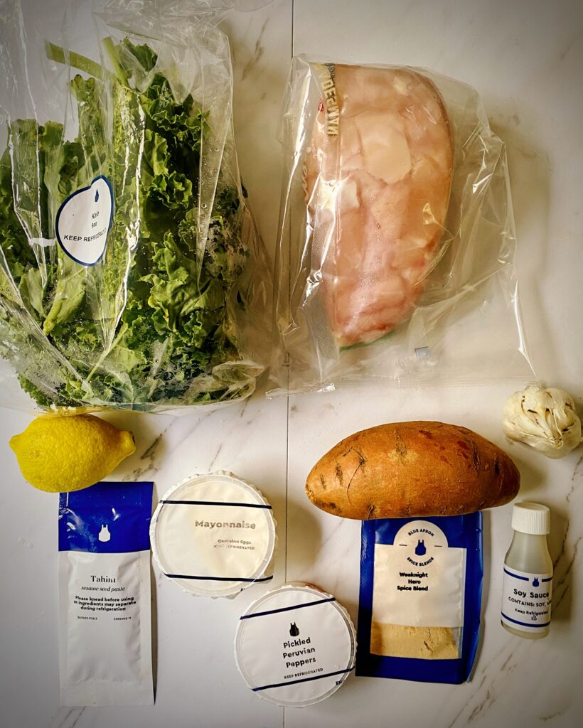 kale, chicken, lemon, sweet potato, garlic, tahini, mayonnaise, spice packet and soy sauce for chicken and kale from blue apron