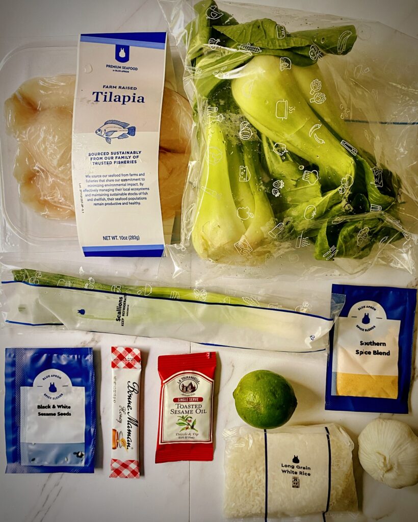 tillapia, bok choy, green onions, rice, lime, and seasoning packets for blue apron tillapia meal