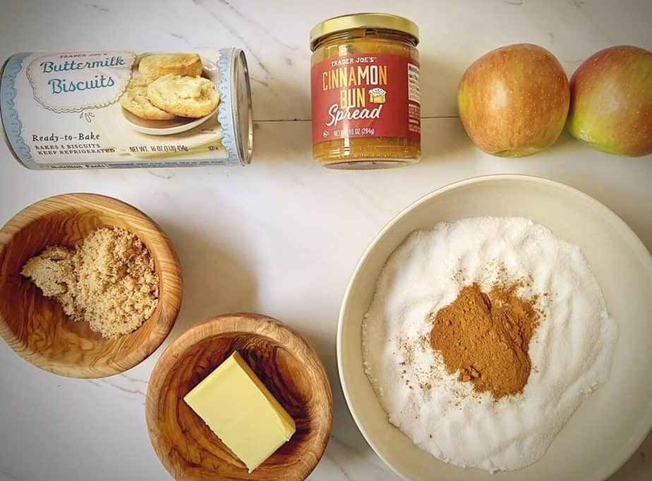 refrigerated biscuit dough, trader joe's cinnamon bun spread, two apples, cinnamon, sugar, butter, and brown sugar as mis en place for monkey bread