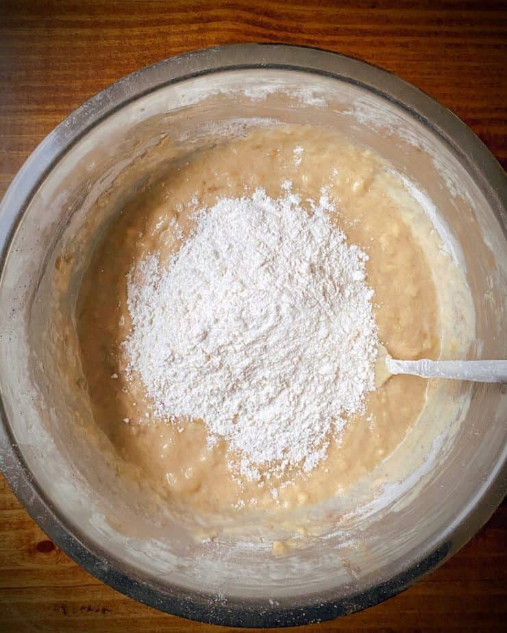 AP flour atop banana breakfast bar batter for second addition