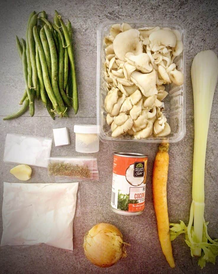 green beans, oyster mushrooms, celery stalk, carrot, can of coconut milk, onion, garlic clove, spices, flour, baking powder, vegan bouillion cube