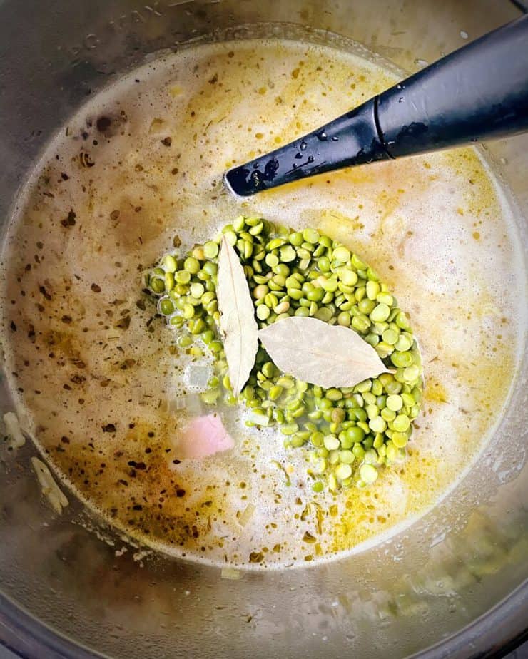 split peas, chicken broth, wine and bay leaves added to the instant pot for split pea soup