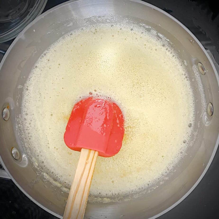 final stage of browning butter - bubbling in saucepan with bubbles that look like head on beer