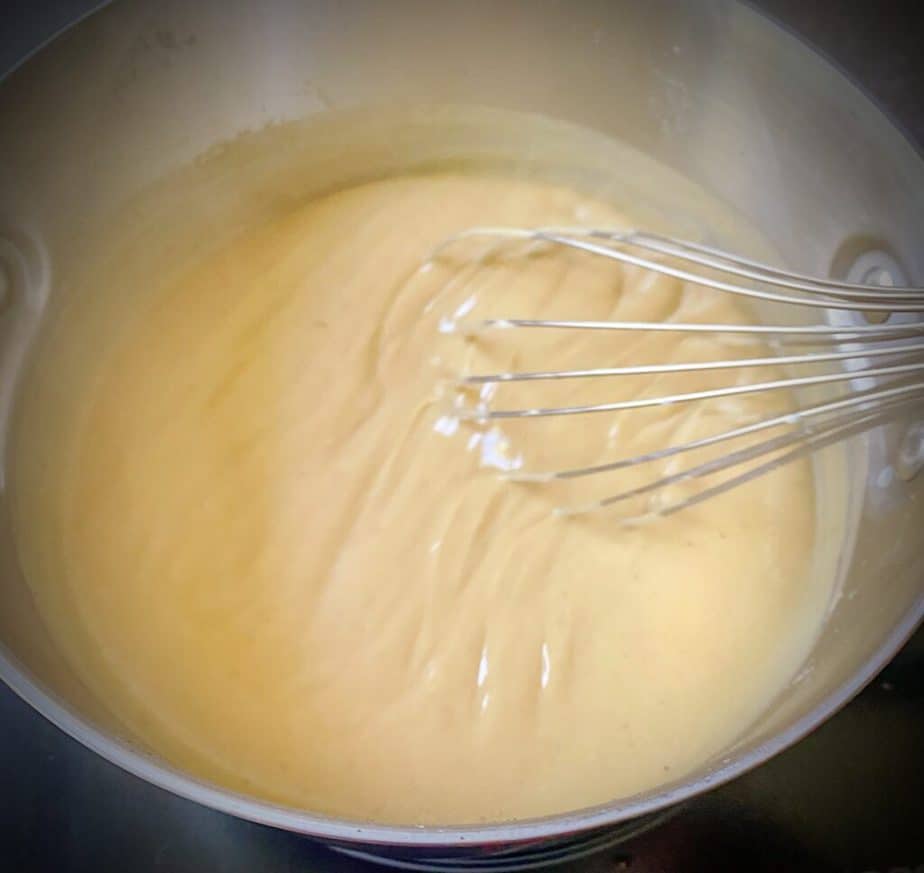 active shot of whisking banana pudding as it thickens, showing trails behind whisk
