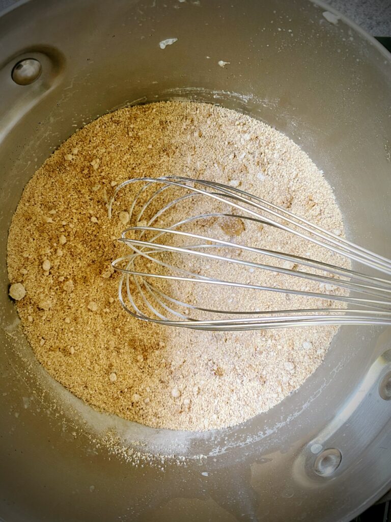 cornstarch, brown sugar, coconut sugar, salt, and cloves whisked together in saucepan