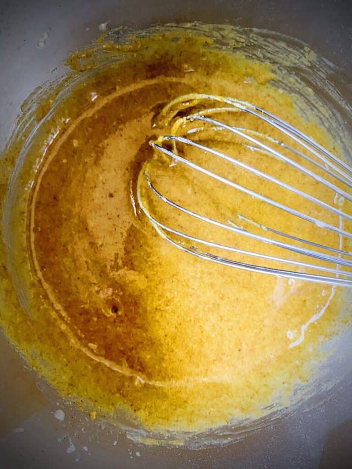 egg yolks and dry pudding ingredients after being whisked together in saucepan