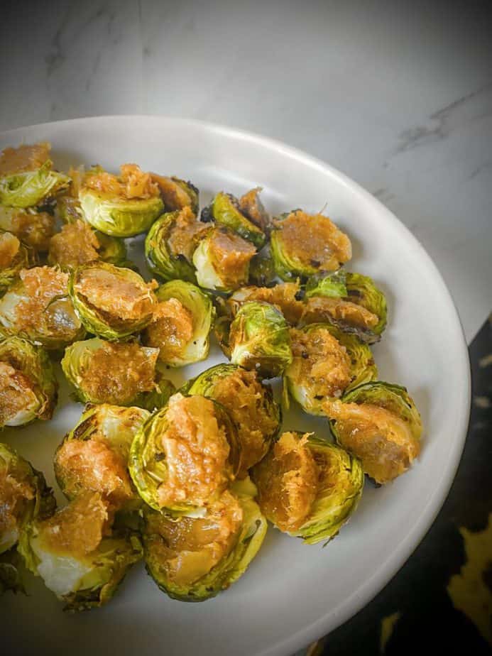 roasted brussels sprouts halves topped with trader joe's bacon jam