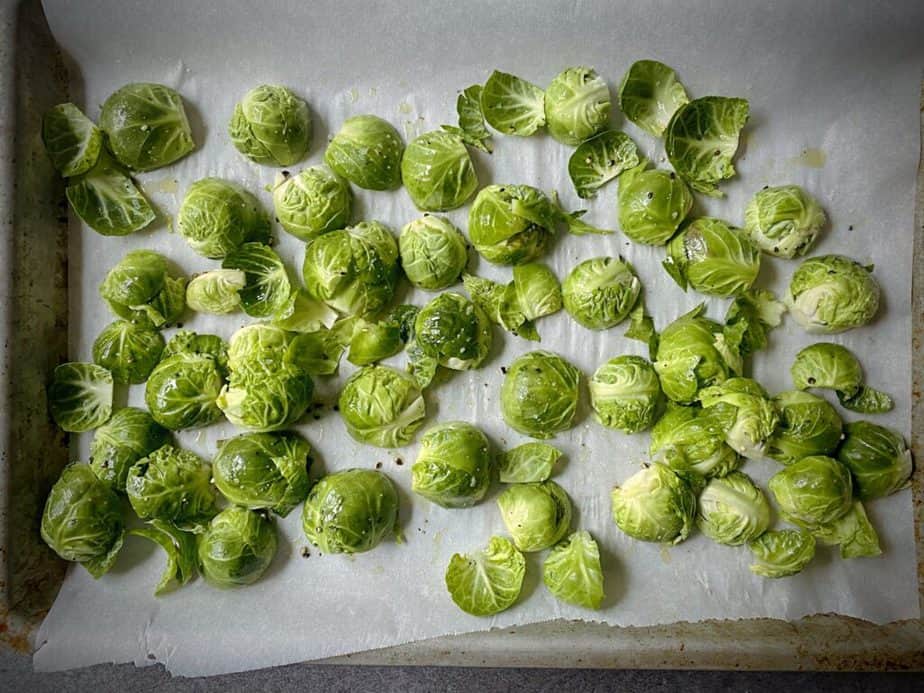 all brussels sprouts on a parchment lined baking sheet with all the brussels sprouts facing cut side down to get maximum browning