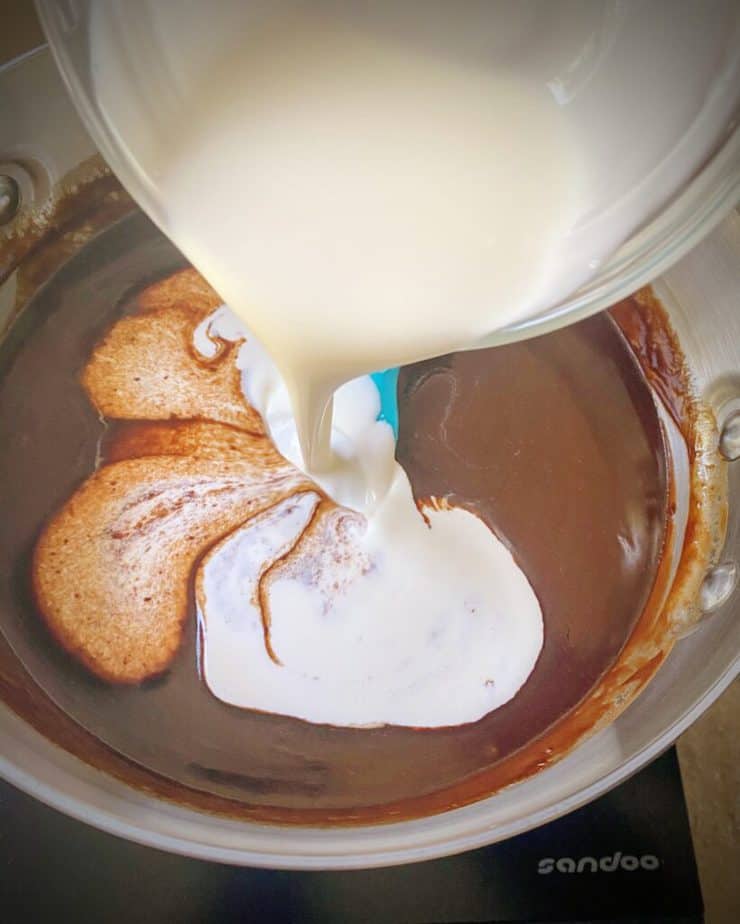 cream being poured into coffee rum fudge mix