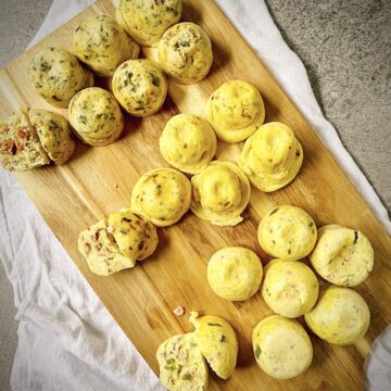 Instant Pot "Sous Vide" Style Egg Bites 3 Ways on a wooden cutting board.