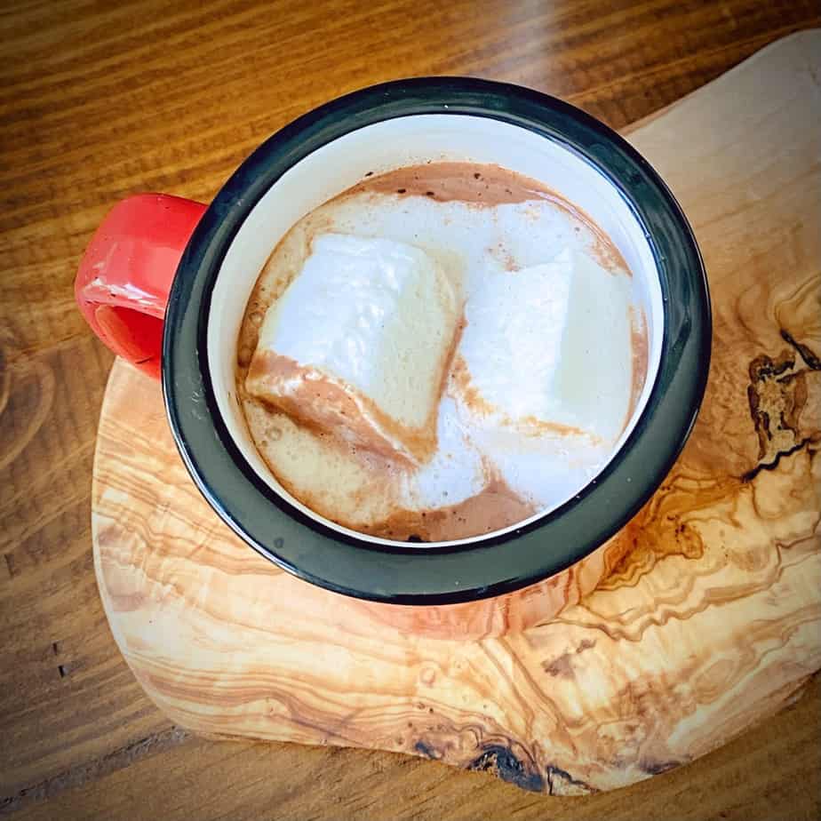 marshmallows melting into a mug of hot chocolate