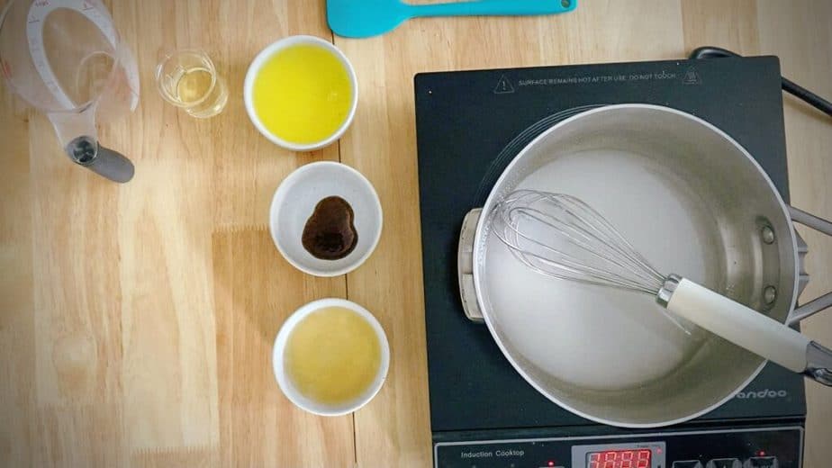 sugar dissolving in water in a saucepan