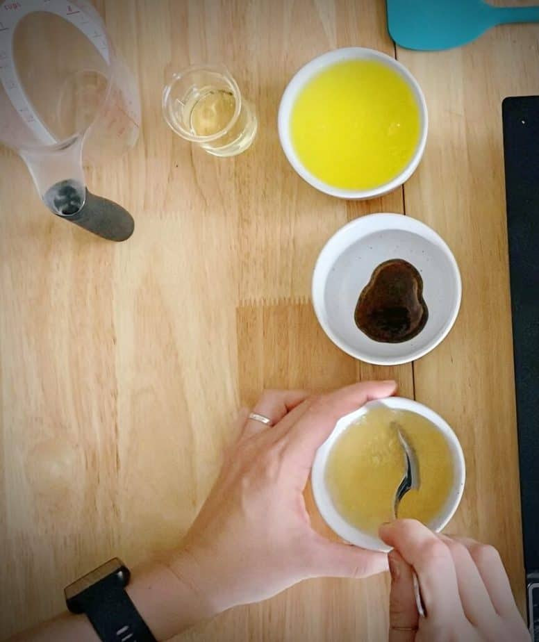 hand stirring bowl with gelatin and water