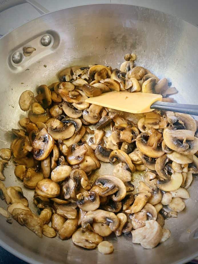 all sautéed mushrooms that have been added back to sauté pan for completing mushroom gravy