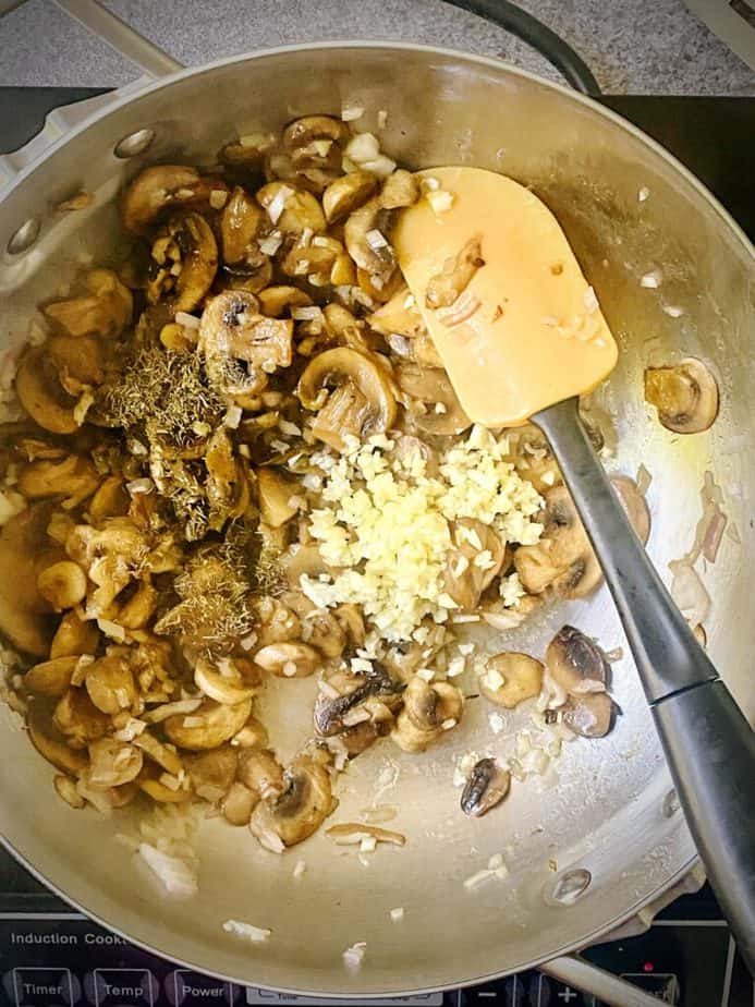 garlic and thyme added to mushroom and onion sauté