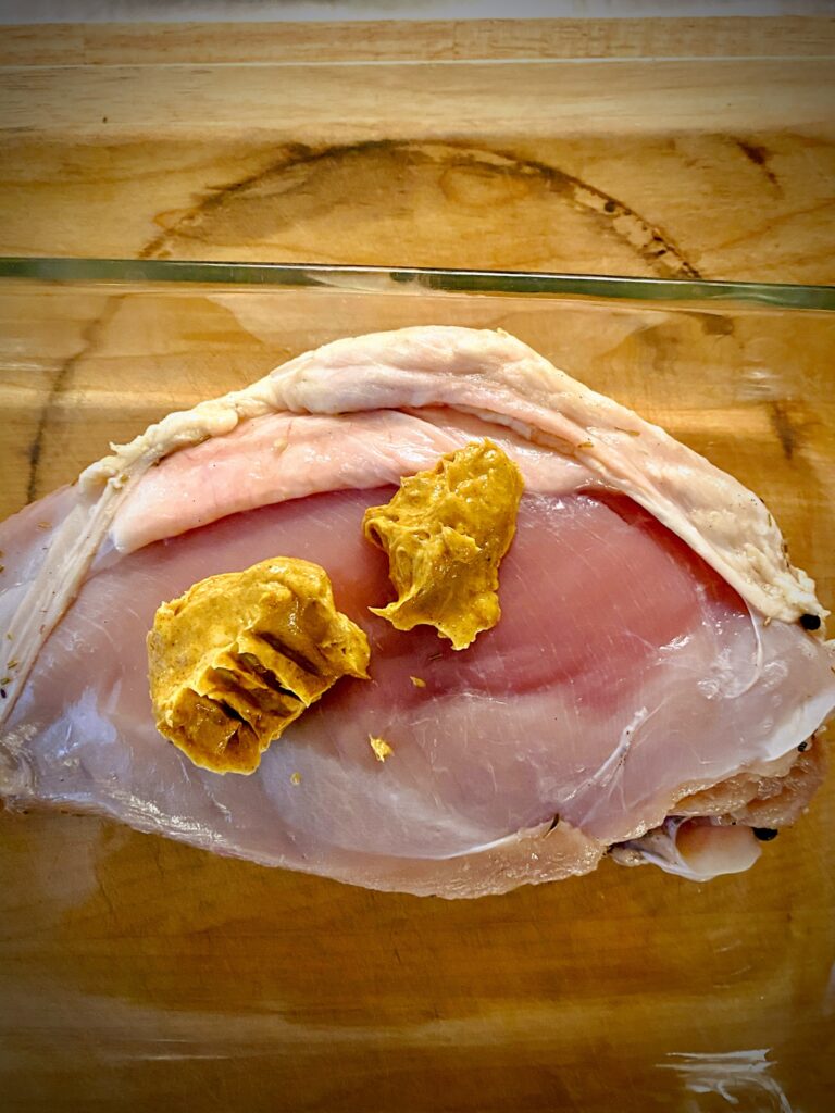 tandoori butter on turkey breast under skin flap
