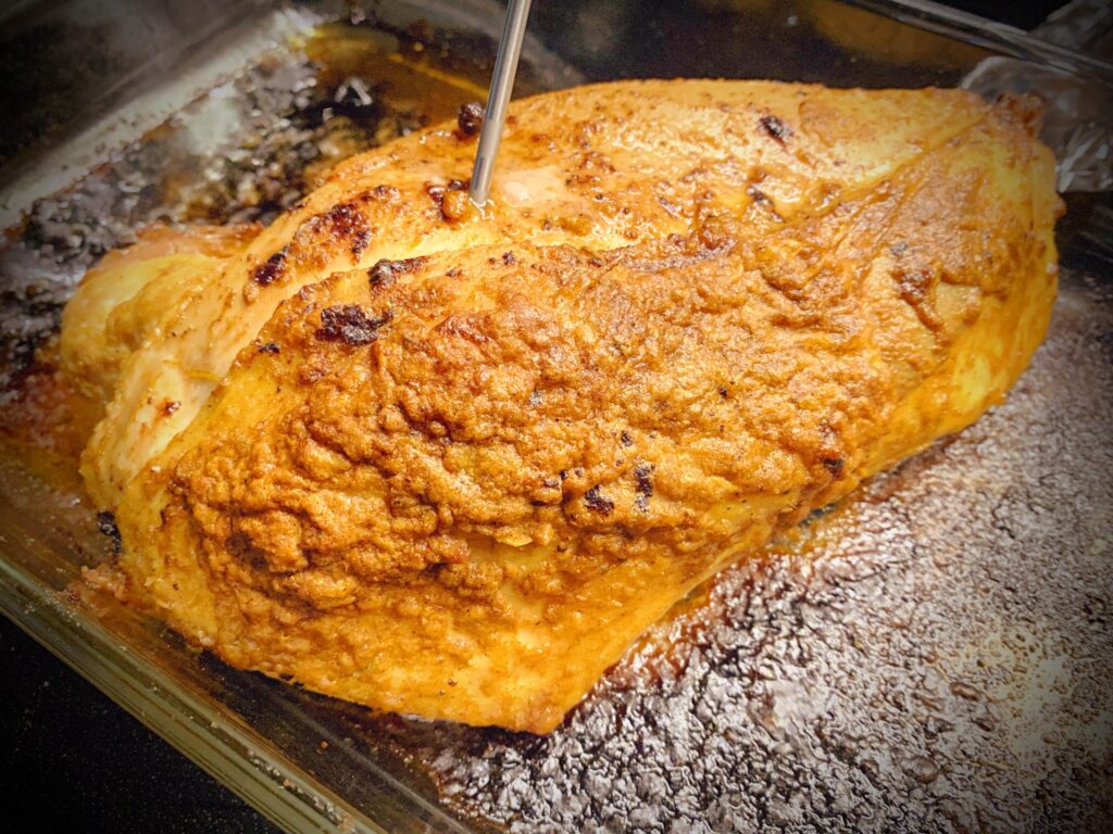 close up shot of completed tandoori roast turkey breast in 9 x 13