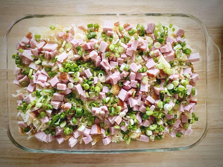 green onions as 4th layer of ham and swiss strata assembly
