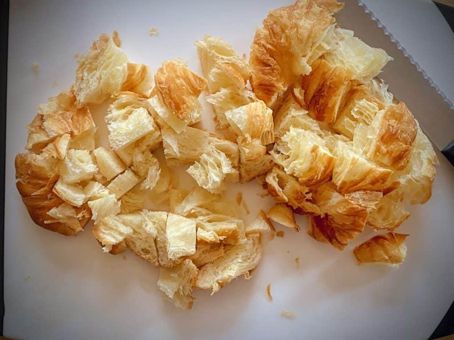 cubes of croissant on cutting board