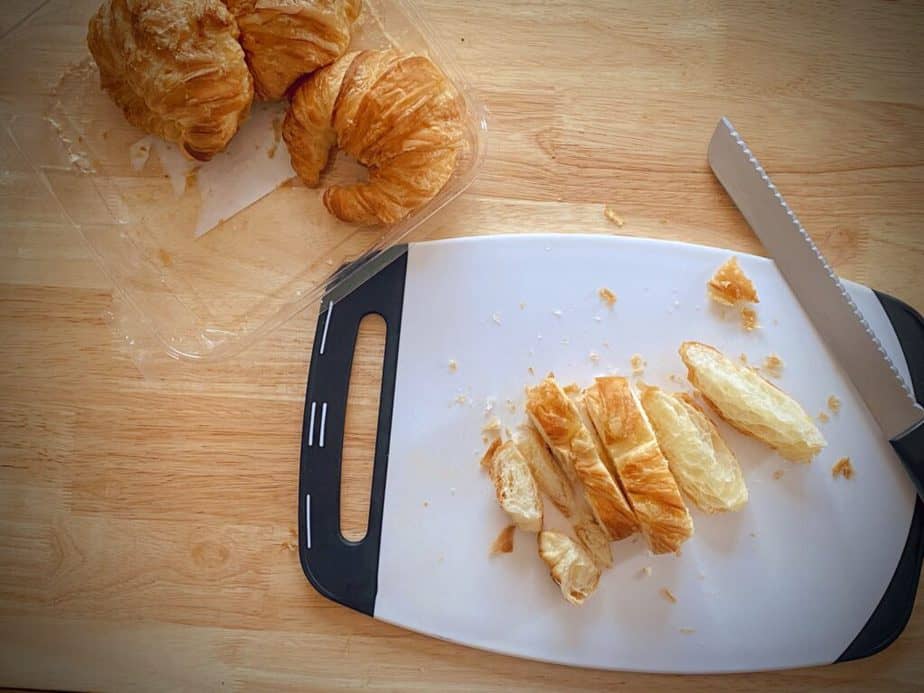 croissant in slices on cutting board