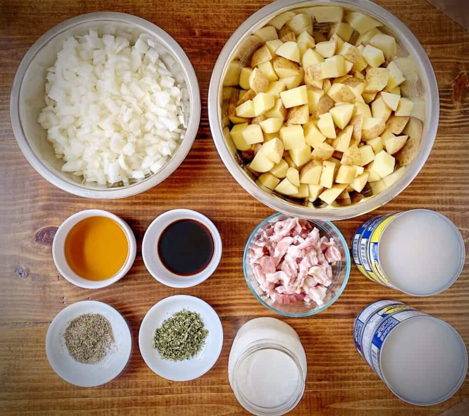 chopped onion, potatoes, sherry, worchestershire, bacon, canned clams, half and half, spices in bowls as mise en place for new england clam chowder