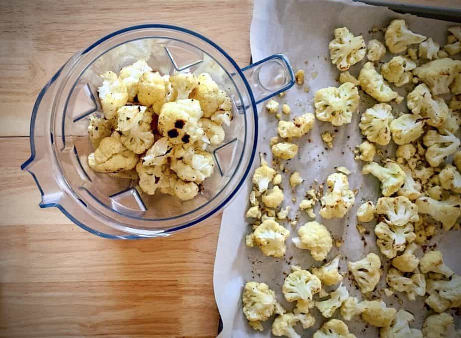 roasted cauliflower added to the pitcher of a blender with cream and butter to get mashed. 