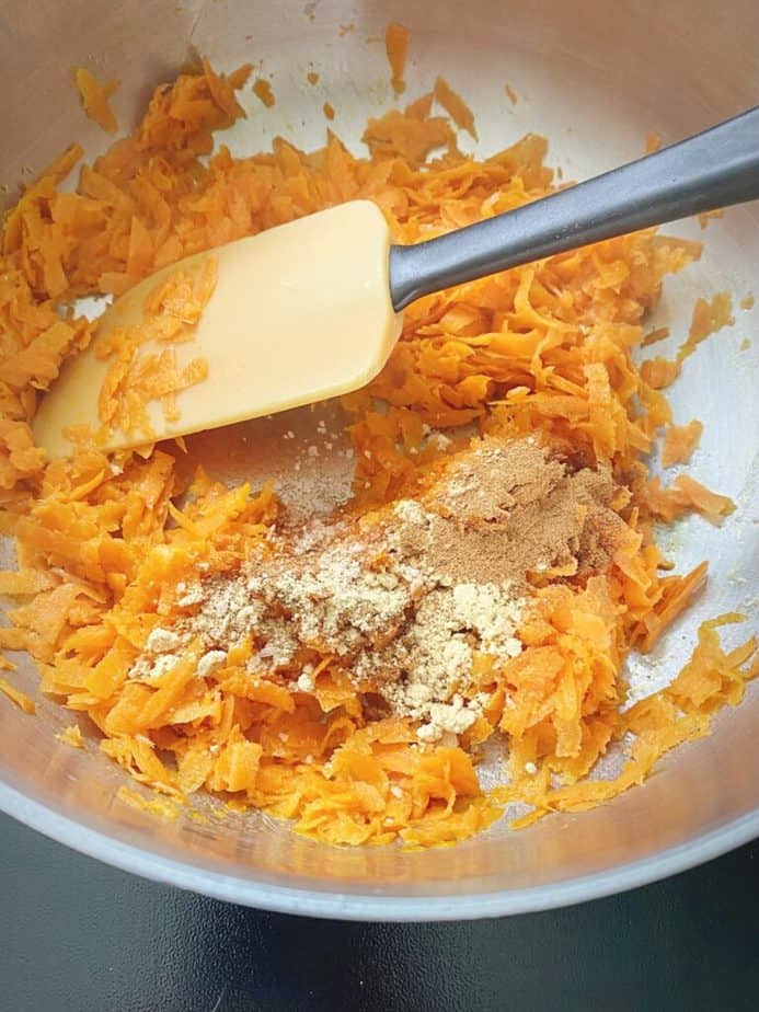 optional step of adding spices and salt to sautéing carrot shreds to temper the seasonings