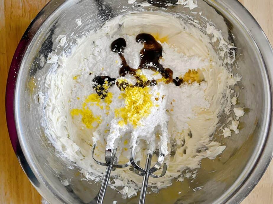 lemon zest, vanilla paste, extracts and powdered sugar added to cream cheese 