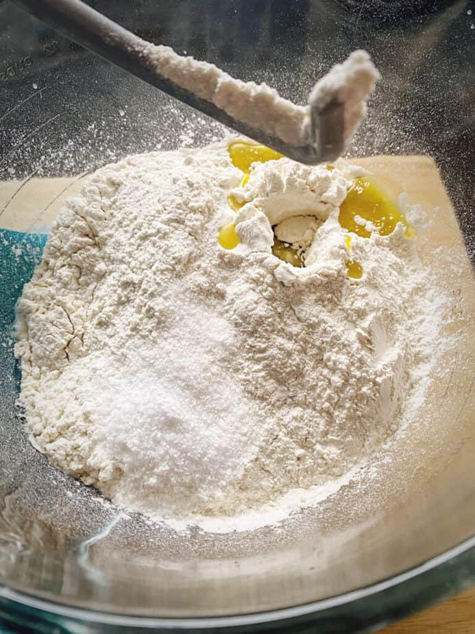 remaining focaccia recipe ingredients added to mixing bowl after yeast is proofed