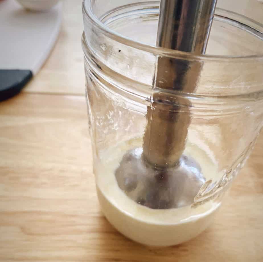 immersion blender whipping cream in a mason jar
