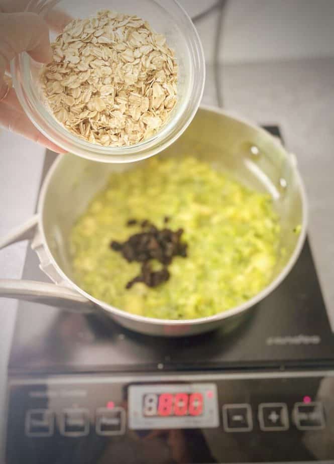 oats being added to saucepan