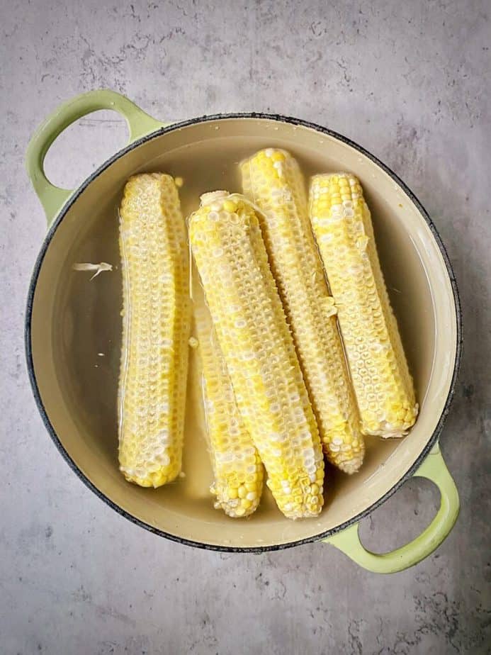 corn cobs covered with water in a dutch oven for making corn stock