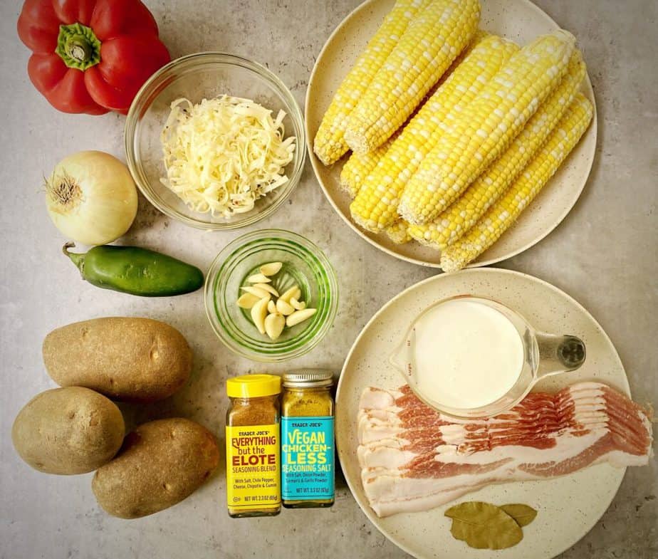 ingredients for easy corn chowder laid out on a grey table