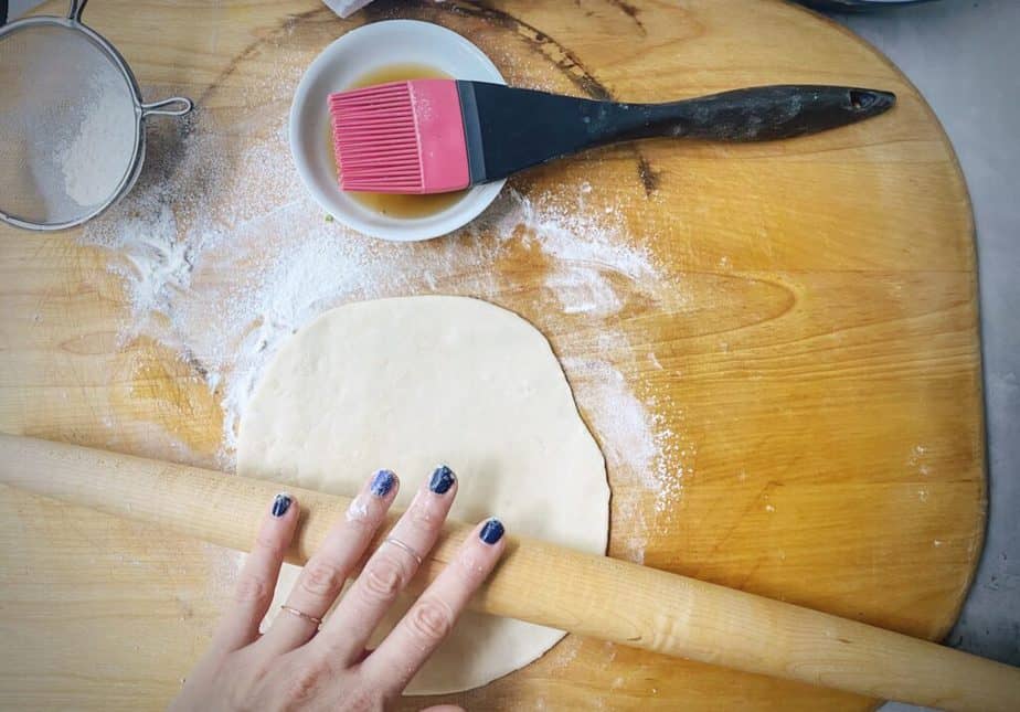 rolling dough out into a round
