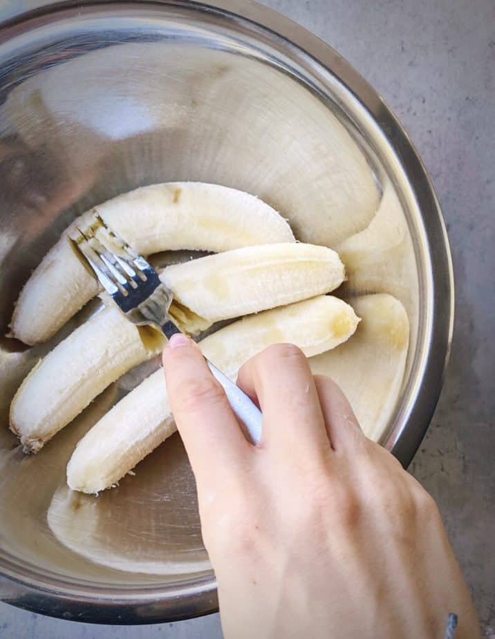 step 1a - mashing bananas with a fork.