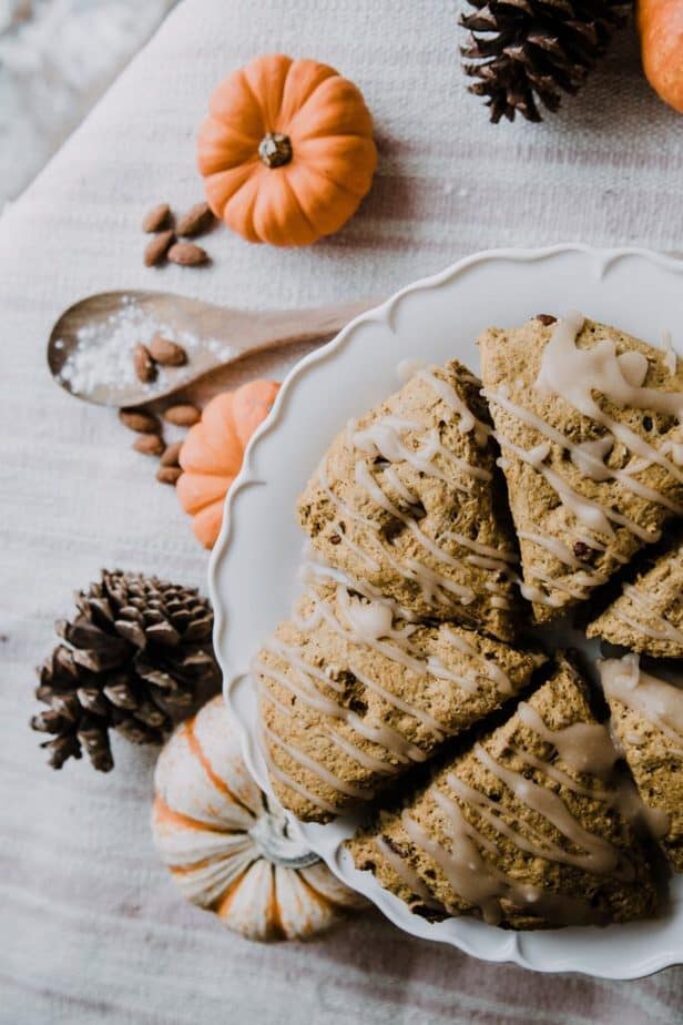 pumpkin nut scones on a white serving plate for an easy holiday breakfast buffet.