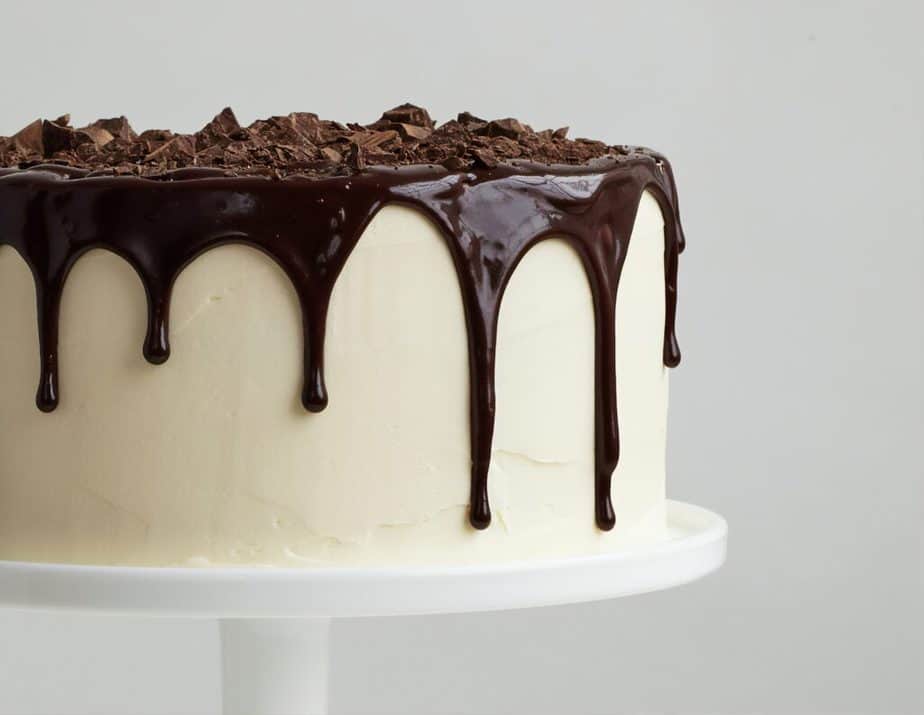 white cake with a chocolate drip.