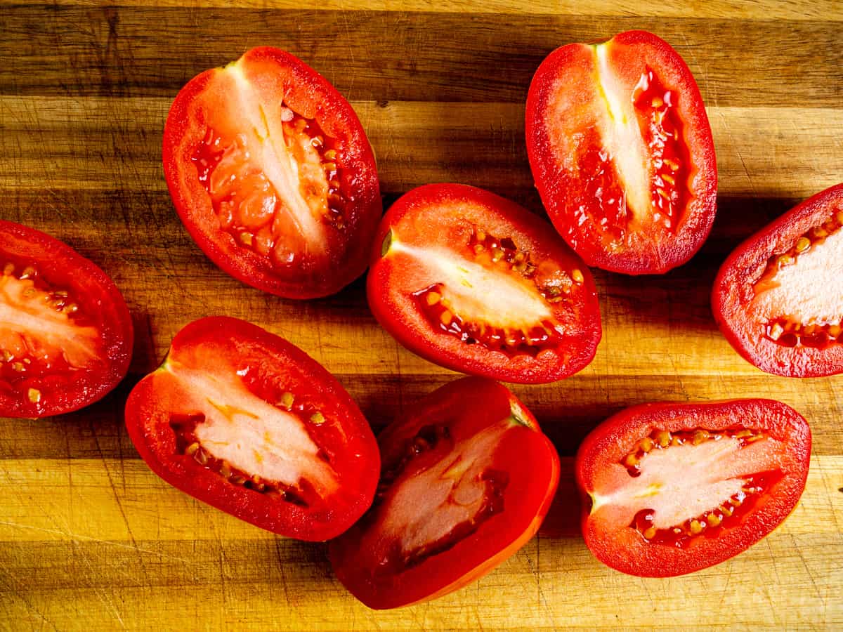 halved roma tomatoes.