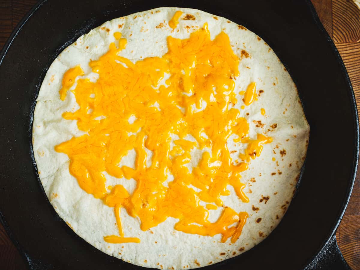 cheddar cheese melted on the tortilla.