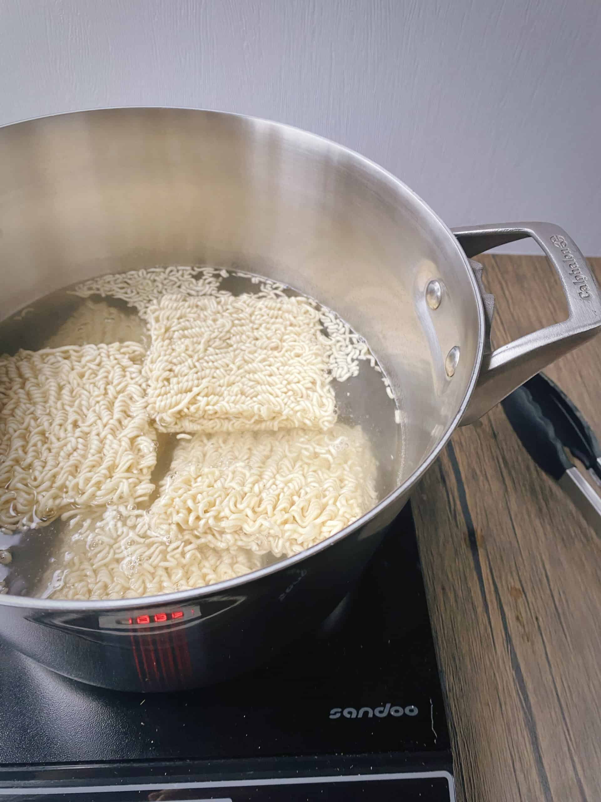 squares of ramen noodles after adding to boiling water.