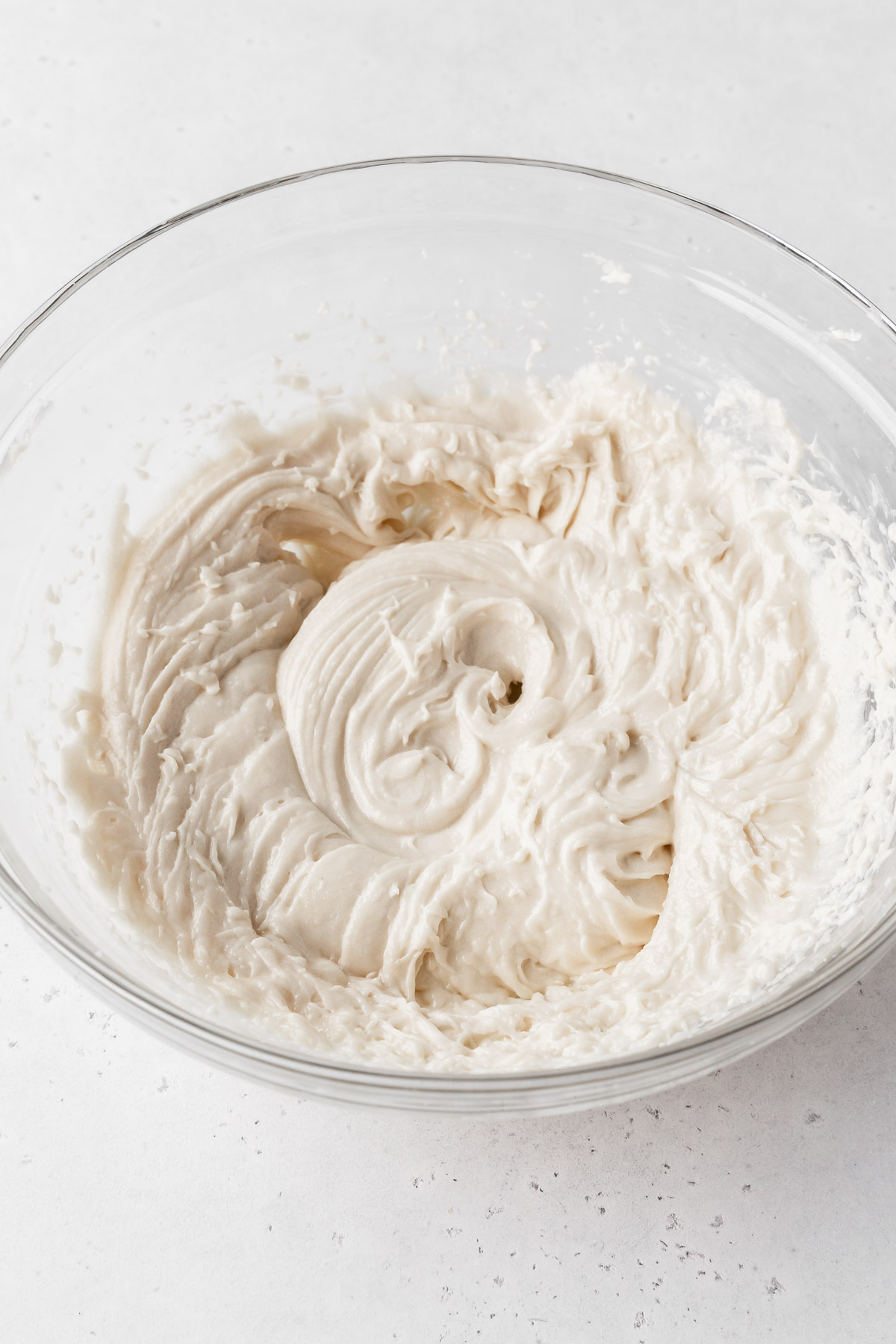 eggless pound cake mixture is light and creamy after the addition of yogurt and extracts.