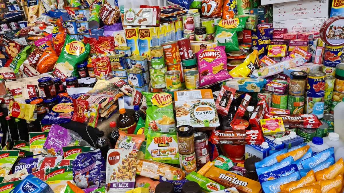 crazy assortment of all kinds of snacks at the discount store food aisle. Photo credit Nico Smit.